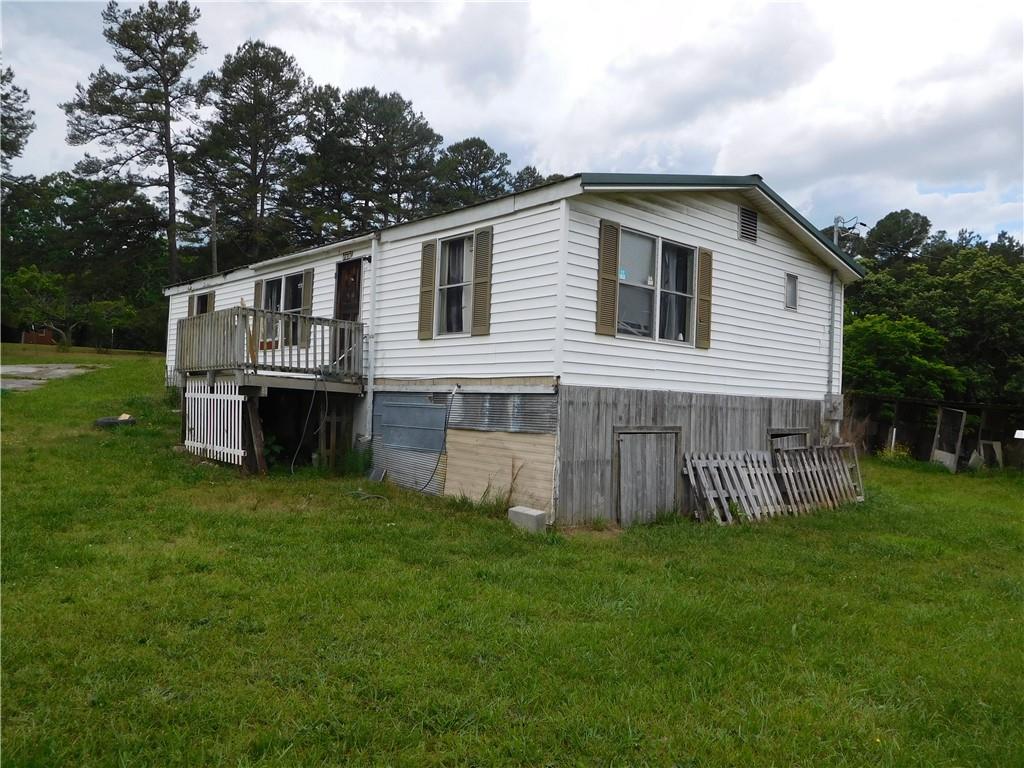 142 Ellis Road Southeast Rome, GA 30161 - Photo 4 of 19 a front view of house with a garden