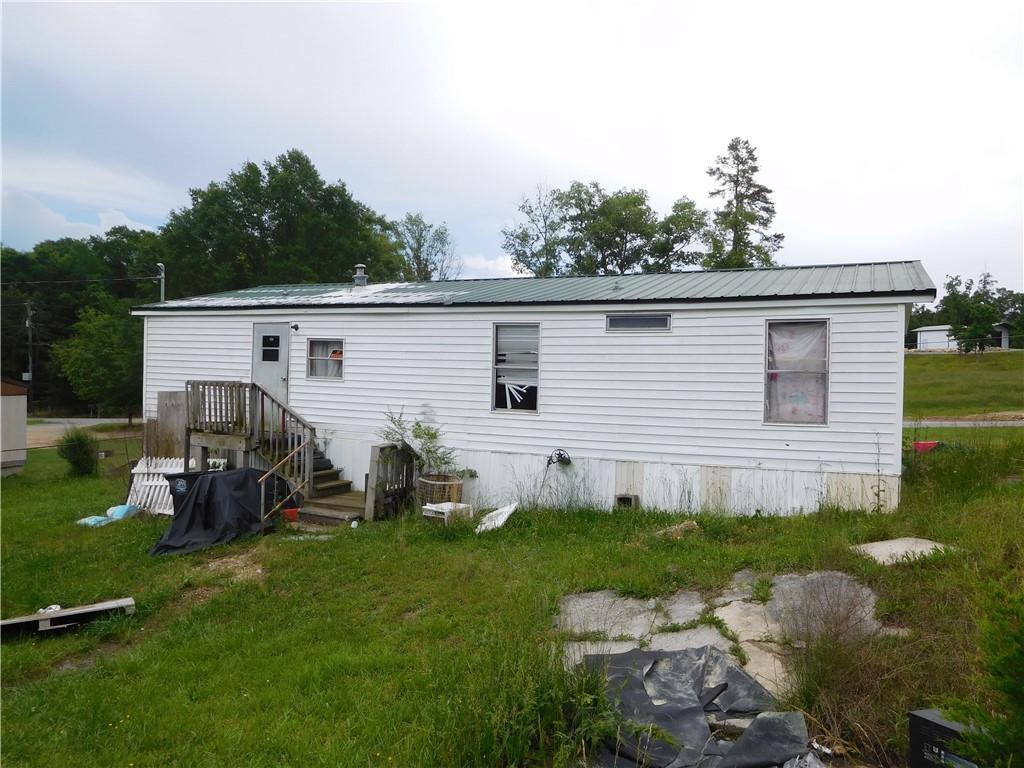 142 Ellis Road Southeast Rome, GA 30161 - Photo 5 of 19 a view of a backyard with plants and a patio