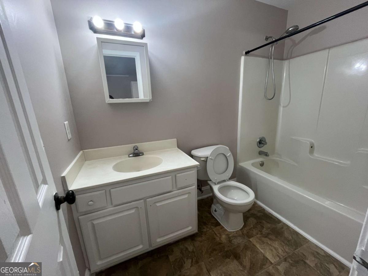 565 Rustwood Drive Athens, GA 30606 - Photo 10 of 16 a bathroom with a sink toilet and shower