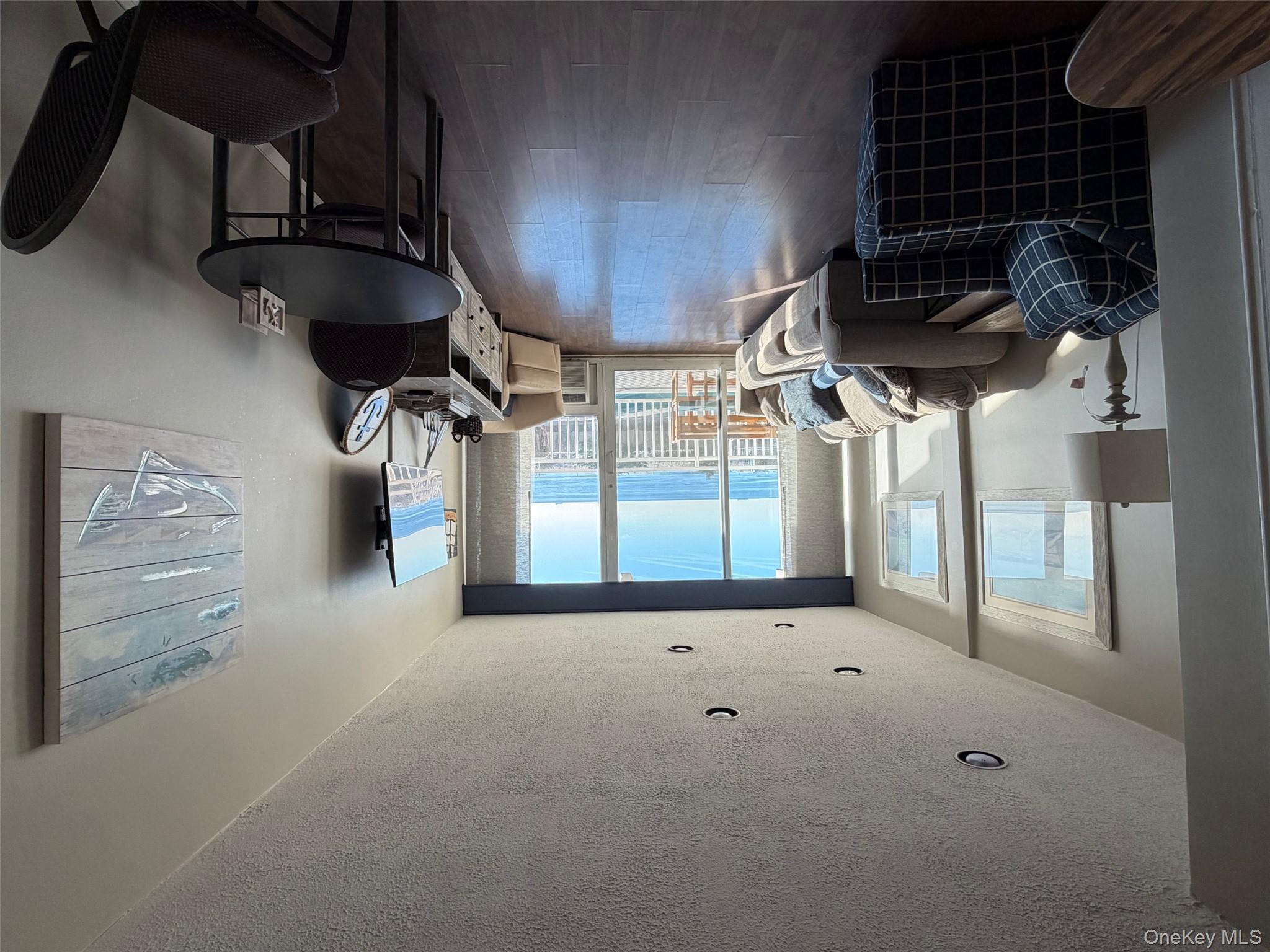 830 Shore, Unit 2O Long Beach, NY 11561 - Photo 5 of 19 a living room with furniture rug and window