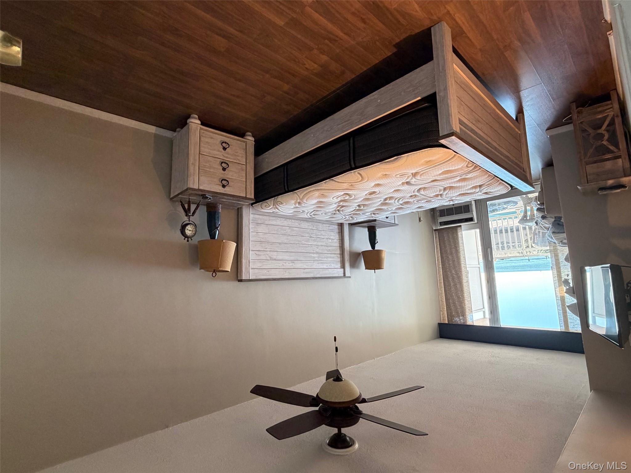 830 Shore, Unit 2O Long Beach, NY 11561 - Photo 7 of 19 a living room with hard wood floors and a bed