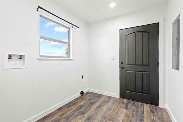 a view of an empty room with cabinet