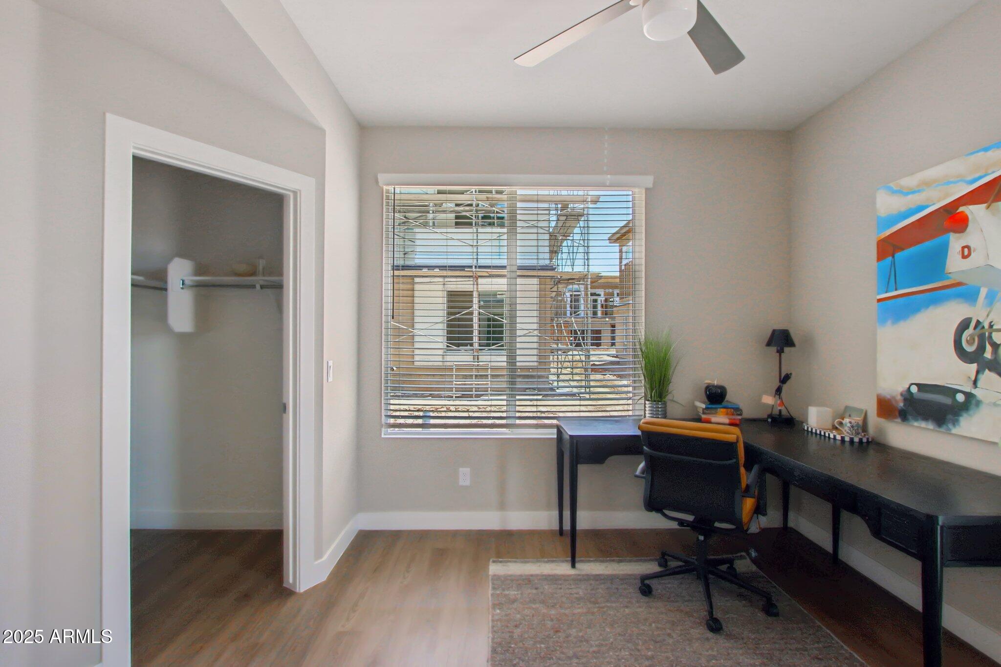 1927 South Recker Road, Unit 163 Mesa, AZ 85206 - Photo 14 of 34 a view of a workspace with furniture and a window