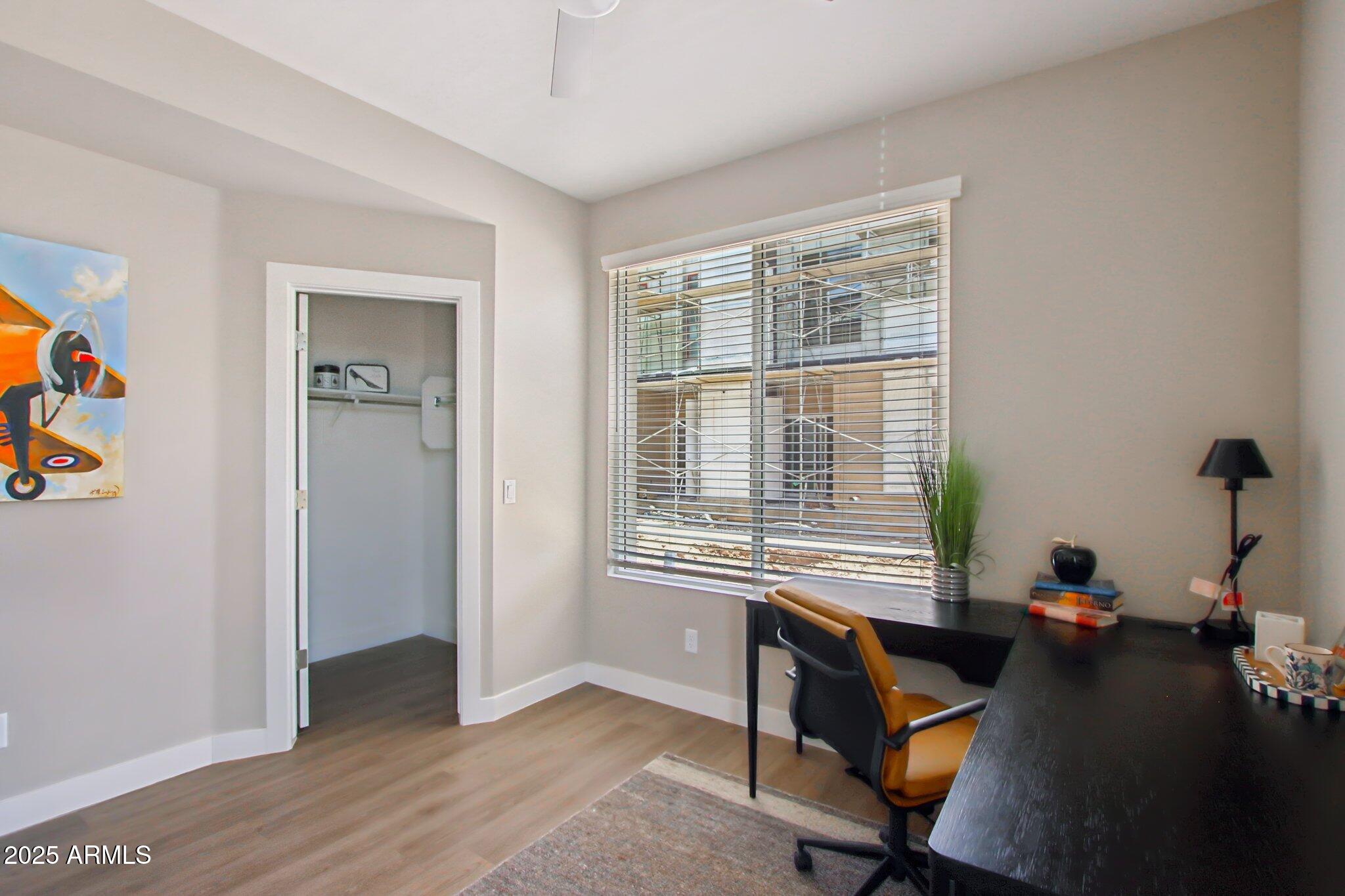 1927 South Recker Road, Unit 163 Mesa, AZ 85206 - Photo 15 of 34 a view of a workspace with furniture and a window