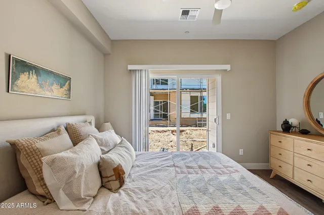 a bath room with a granite countertop toilet and a sink
