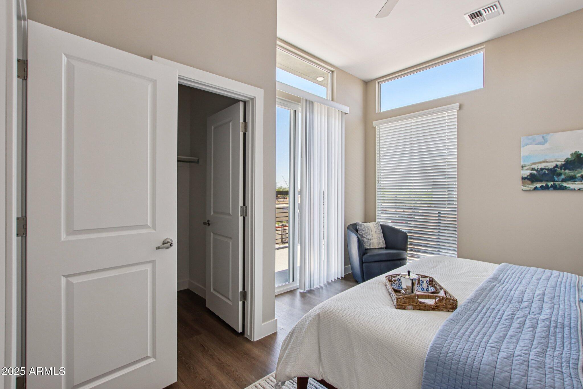 1927 South Recker Road, Unit 163 Mesa, AZ 85206 - Photo 22 of 34 a bedroom with a bed and a window