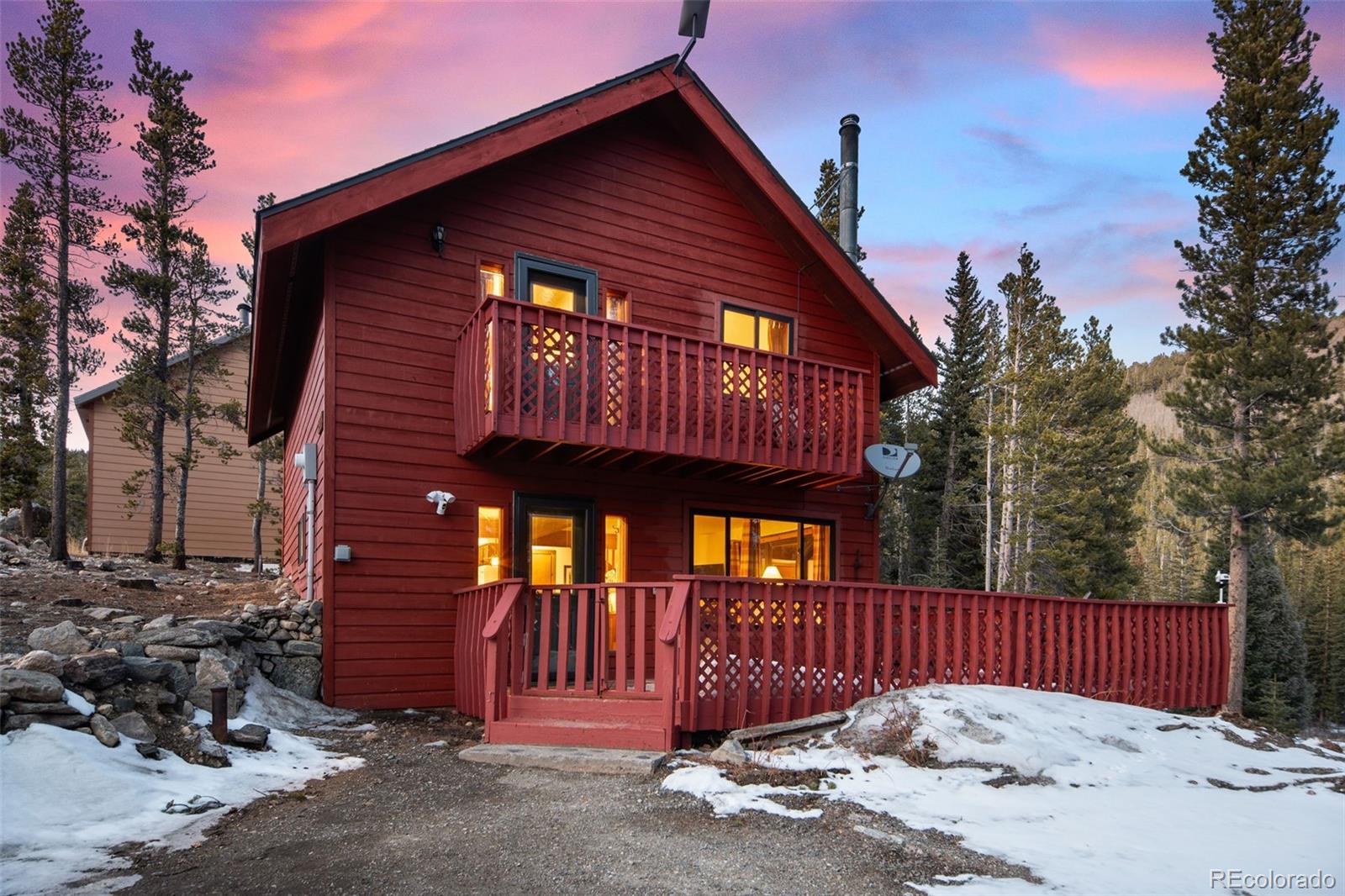 838 Silver Creek Road Idaho Springs, CO 80452 - Photo 18 of 29 a front view of a house with iron fence