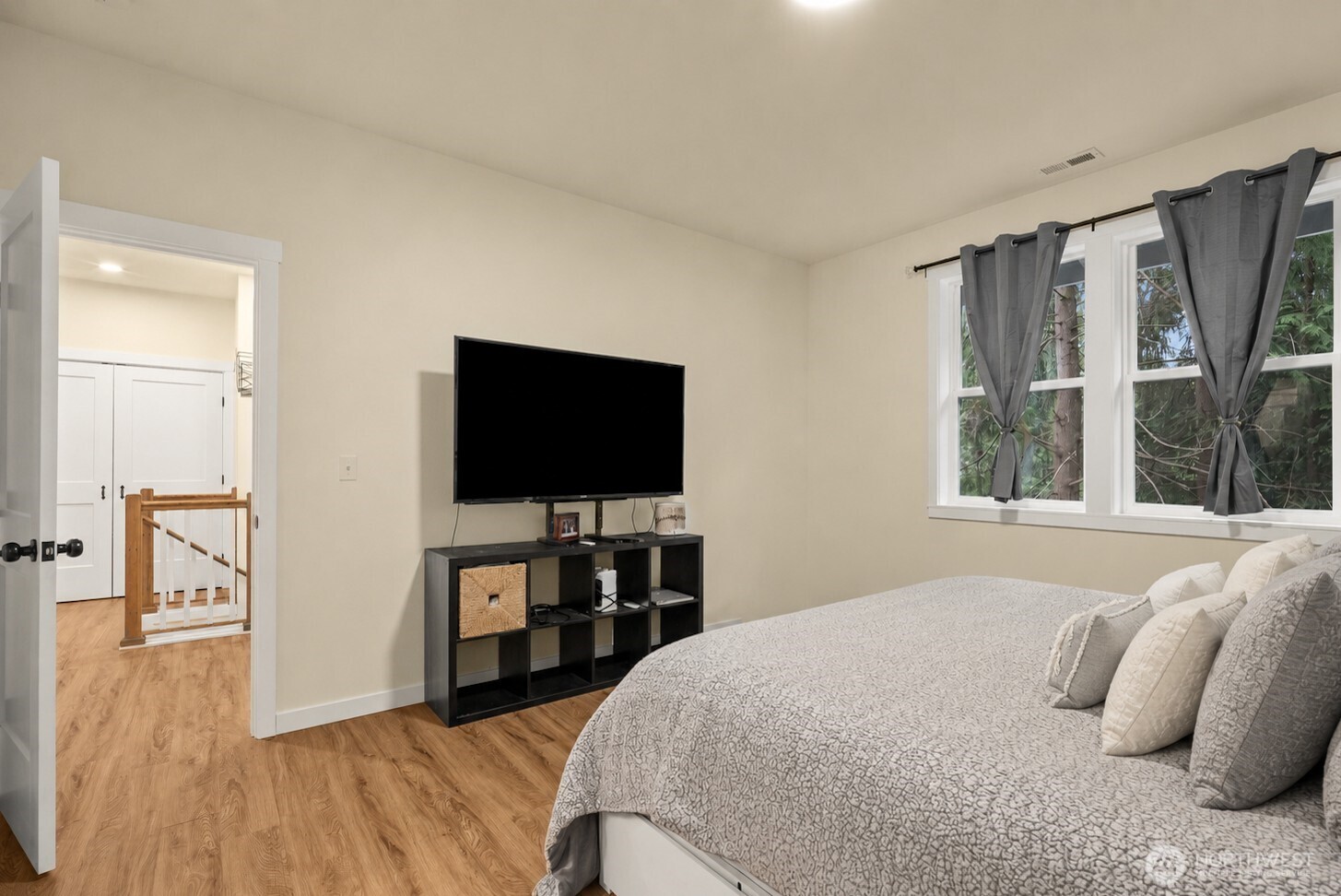 23 Spring Court Bellingham, WA 98229 - Photo 18 of 38 a bedroom with a bed and a flat screen tv