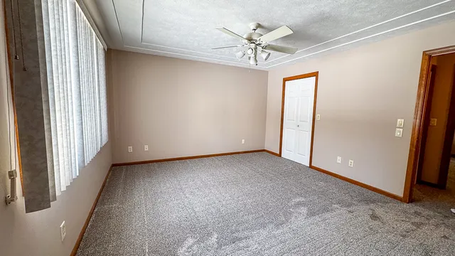 a bathroom with a toilet and shower