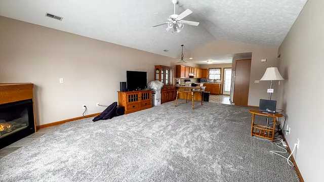 a view of a livingroom with furniture and a fireplace