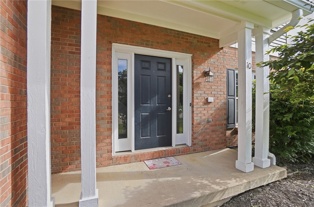 10 Chase Court Springboro, OH 45066 - Photo 6 of 75 An inviting entryway with a brick facade welcomes you home, hinting at comfort within.