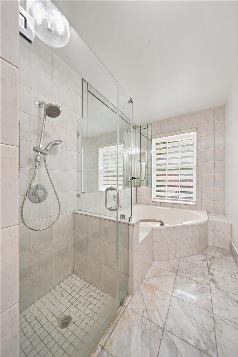 20009 Northwest 66th Place Hialeah, FL 33015 - Photo 20 of 33 a bathroom with a bathtub and shower