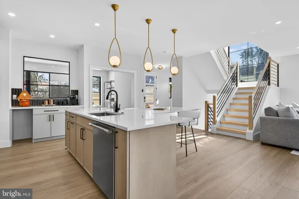 a kitchen with appliances cabinets and a sink
