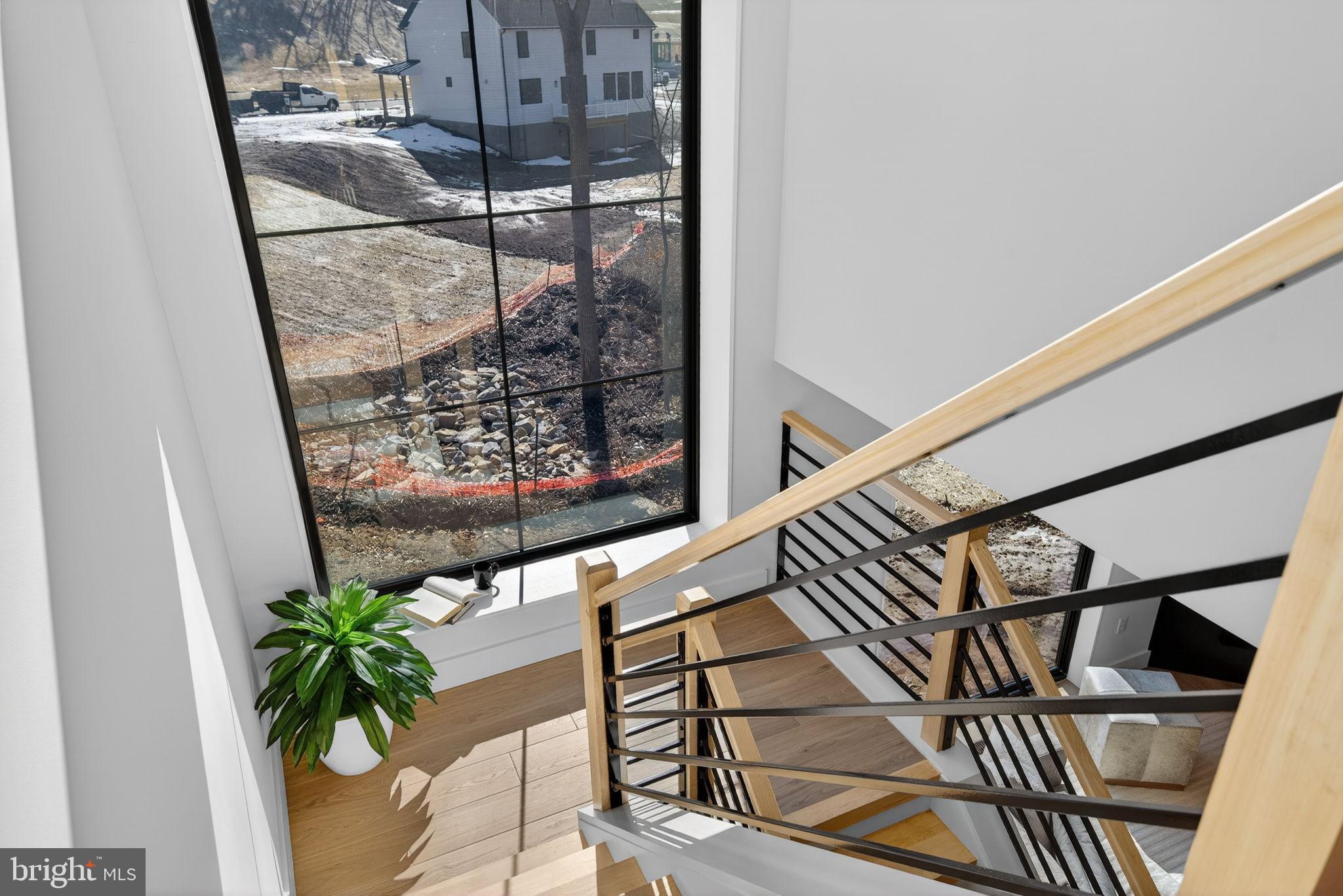 Anvil Model Lot #4 Anvil Model, Unit 4 Womelsdorf, PA 19567 - Photo 42 of 68 Modern staircase with scenic outdoor view.