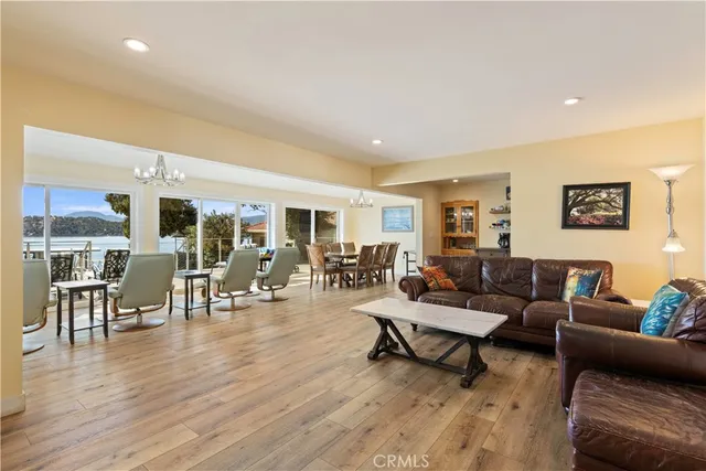 a kitchen with stainless steel appliances kitchen island granite countertop a refrigerator and a stove top oven