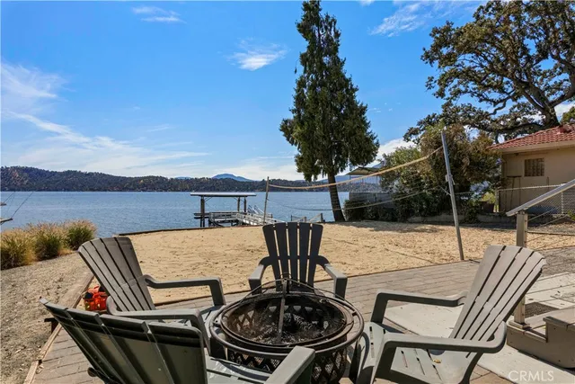 a view of a swimming pool with sitting area and garden