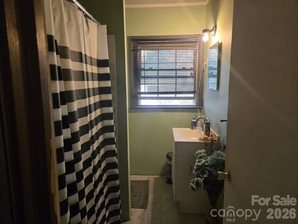 a bathroom with a bathtub and shower