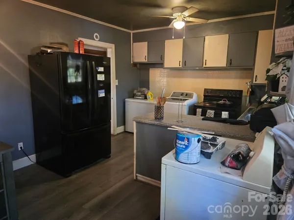 a kitchen with stainless steel appliances granite countertop a refrigerator and stove