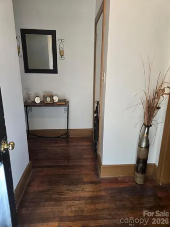 a view of entryway with wooden floor