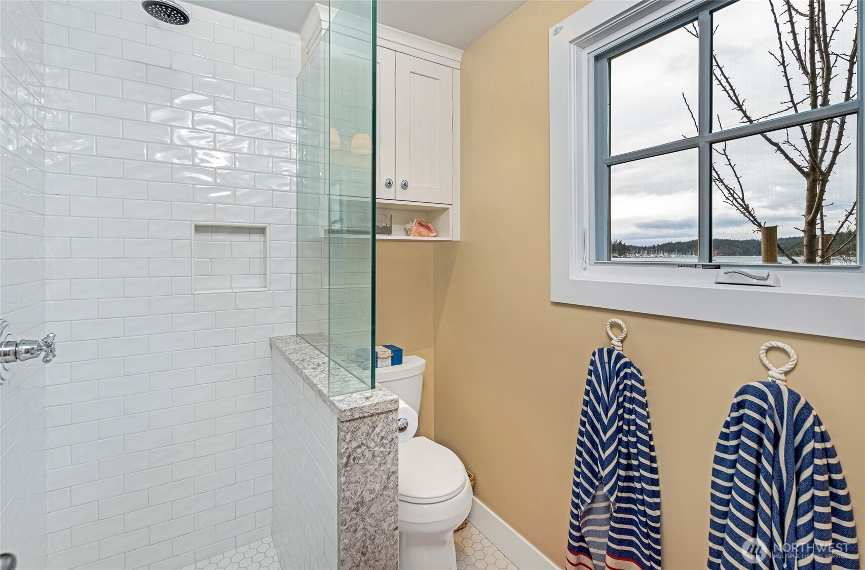 95 Laurel Point Lane Friday Harbor, WA 98250 - Photo 25 of 40 a bathroom with a toilet a sink and a window