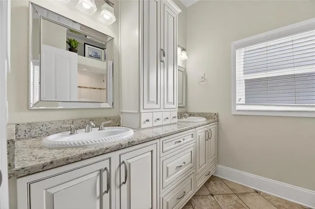 a spacious bedroom with a bed and window