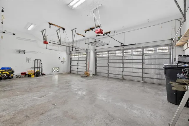 a spacious bedroom with a bed and a window