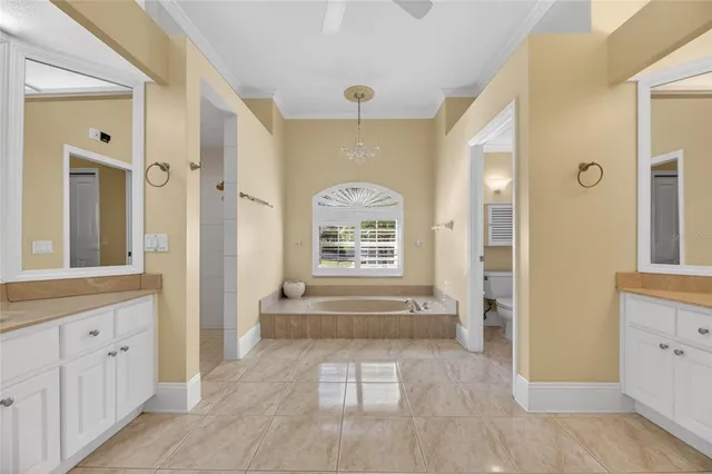a view of kitchen and dining area with a large window