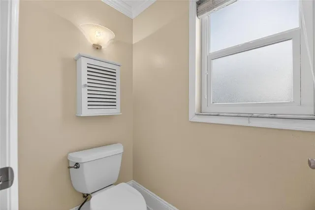 a kitchen with granite countertop a stove microwave and refrigerator