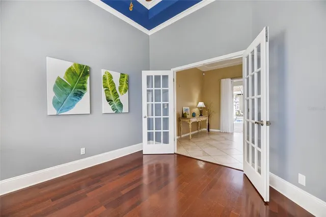 a kitchen with a refrigerator and a sink