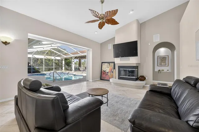 a view of a swimming pool with outdoor seating