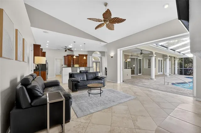 a view of a swimming pool with outdoor seating