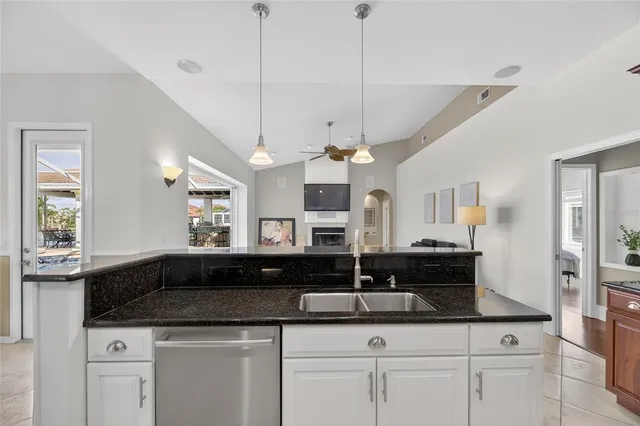 a view of a lake with houses in the back