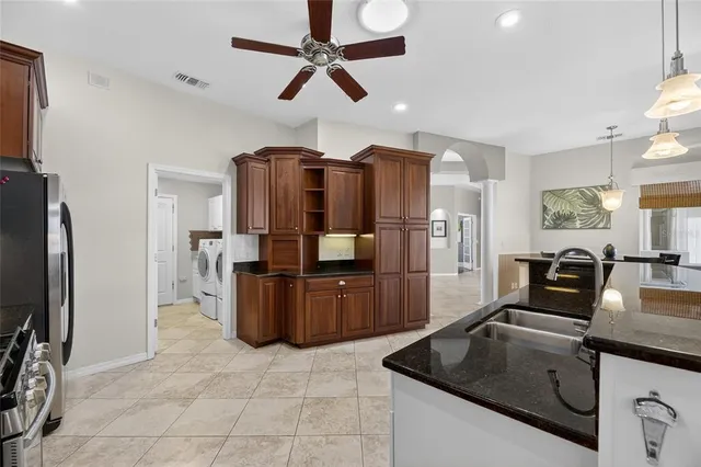 a building outdoor space with patio furniture and potted plants