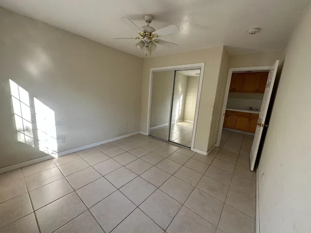 a kitchen with a cabinets and white appliances
