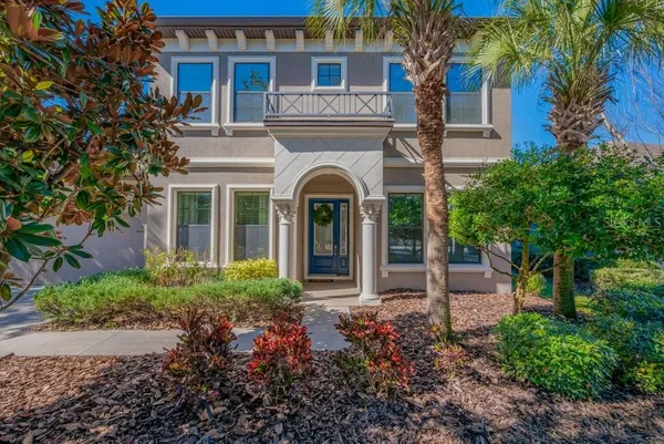 a front view of a house with garden