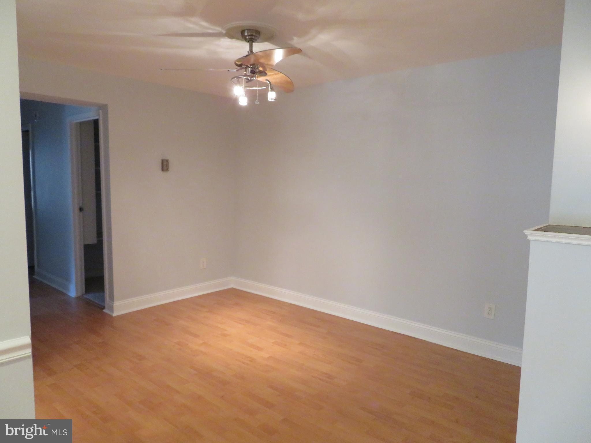 11236 Chestnut Grove Square, Unit 261 Reston, VA 20190 - Photo 16 of 30 an empty room with a chandelier fan