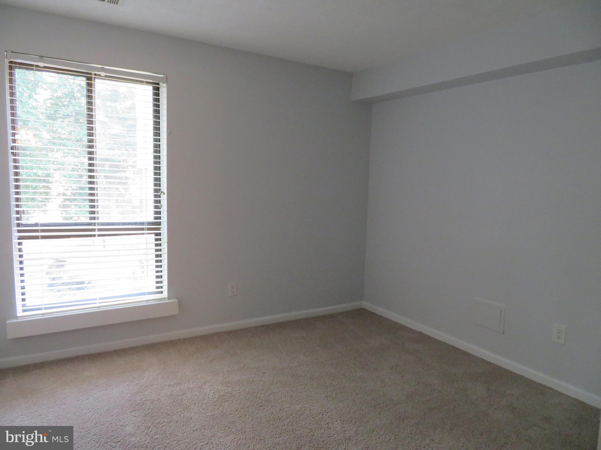 11236 Chestnut Grove Square, Unit 261 Reston, VA 20190 - Photo 18 of 30 an empty room with a window