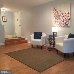 11236 Chestnut Grove Square, Unit 261 Reston, VA 20190 - Photo 3 of 30 a bedroom with furniture and window