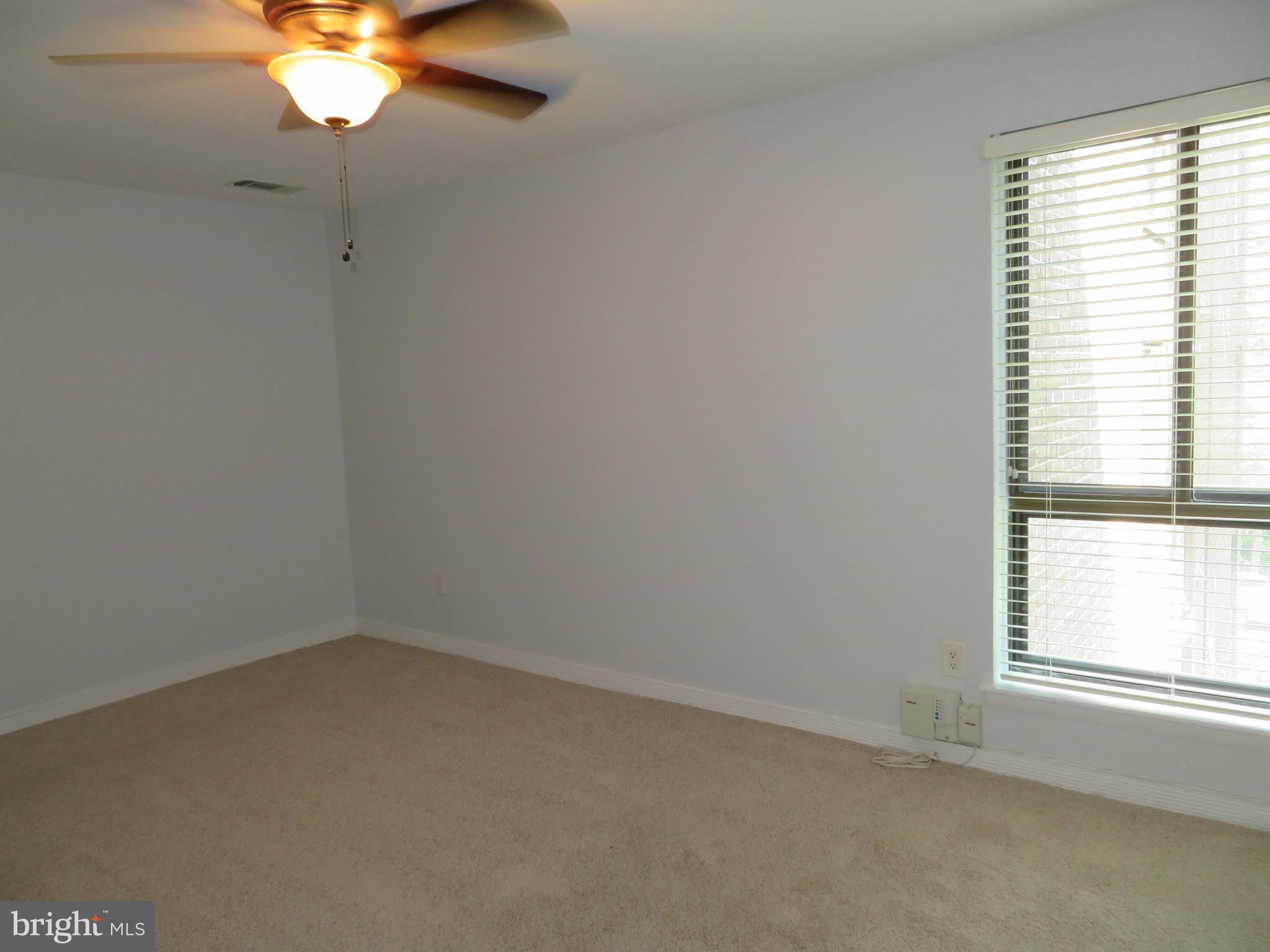 11236 Chestnut Grove Square, Unit 261 Reston, VA 20190 - Photo 25 of 30 an empty room with a window