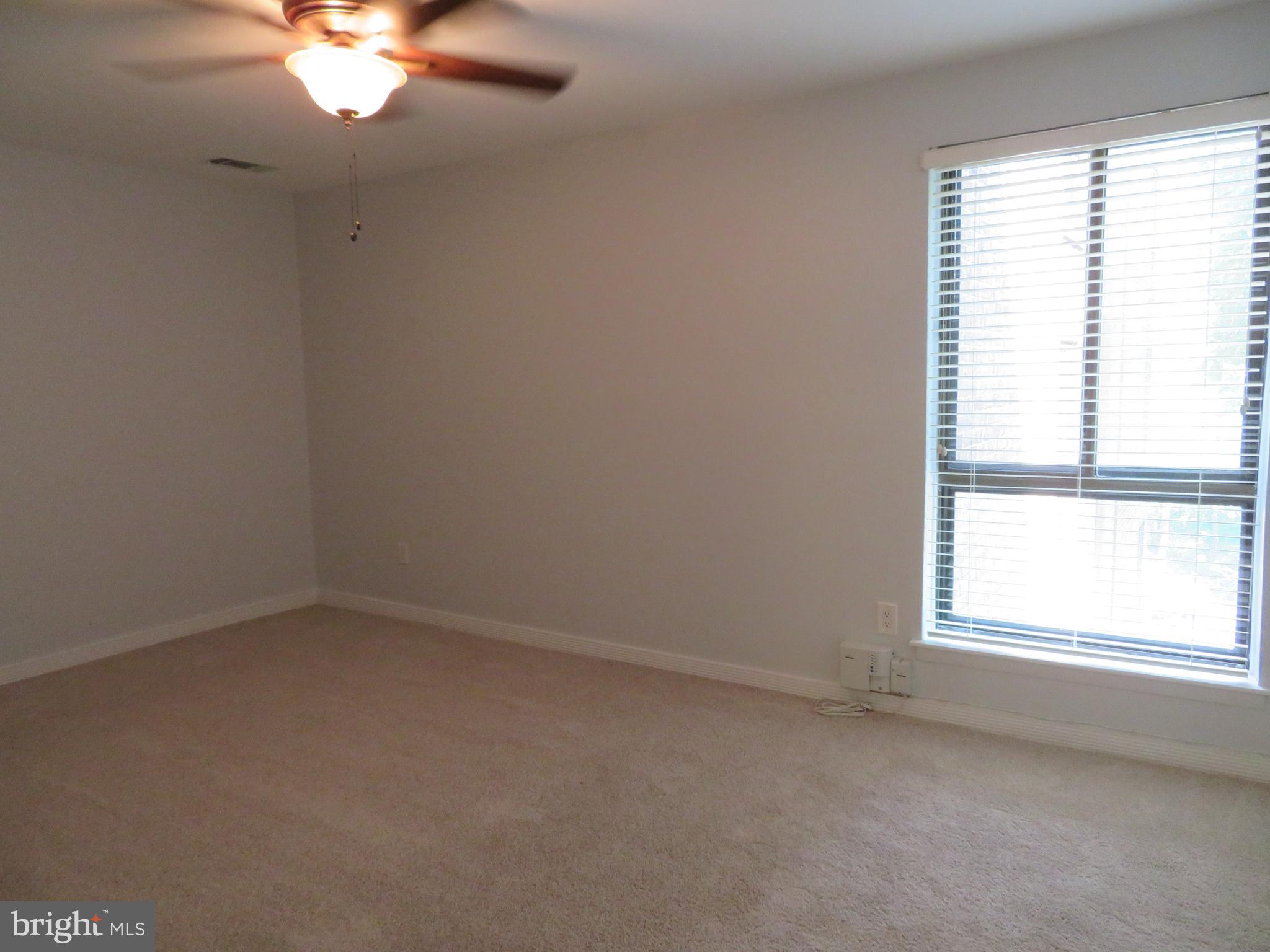 11236 Chestnut Grove Square, Unit 261 Reston, VA 20190 - Photo 26 of 30 an empty room with a window