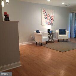 11236 Chestnut Grove Square, Unit 261 Reston, VA 20190 - Photo 6 of 30 a living room with furniture and a window