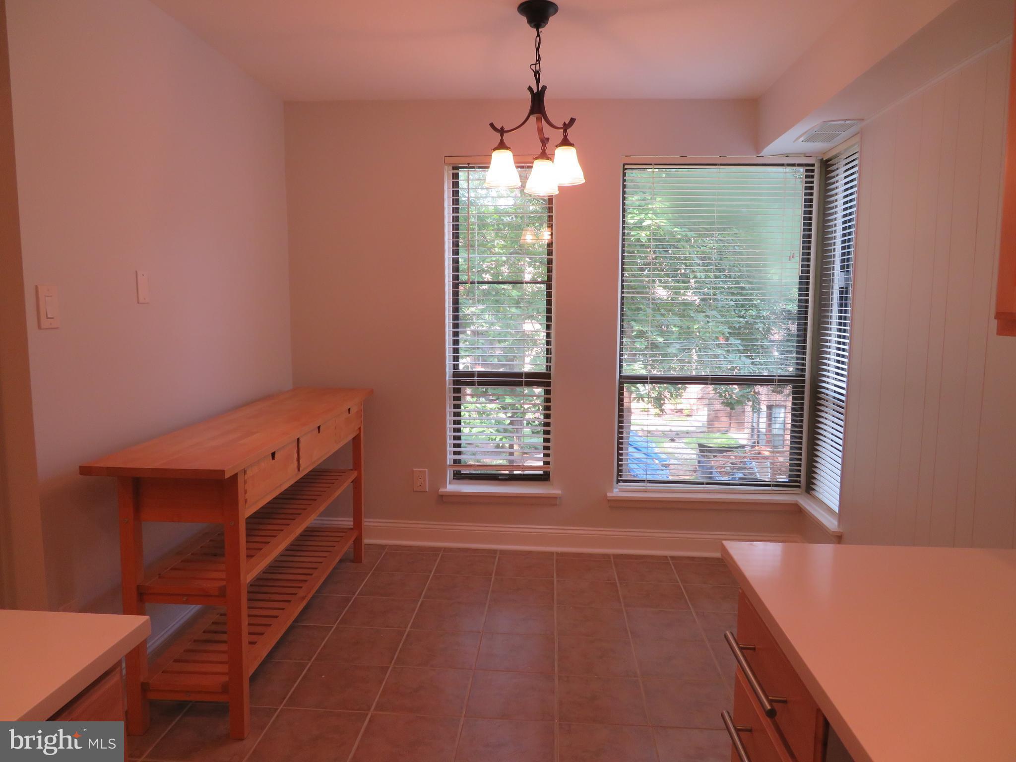 11236 Chestnut Grove Square, Unit 261 Reston, VA 20190 - Photo 10 of 30 a room with window and a wooden floor