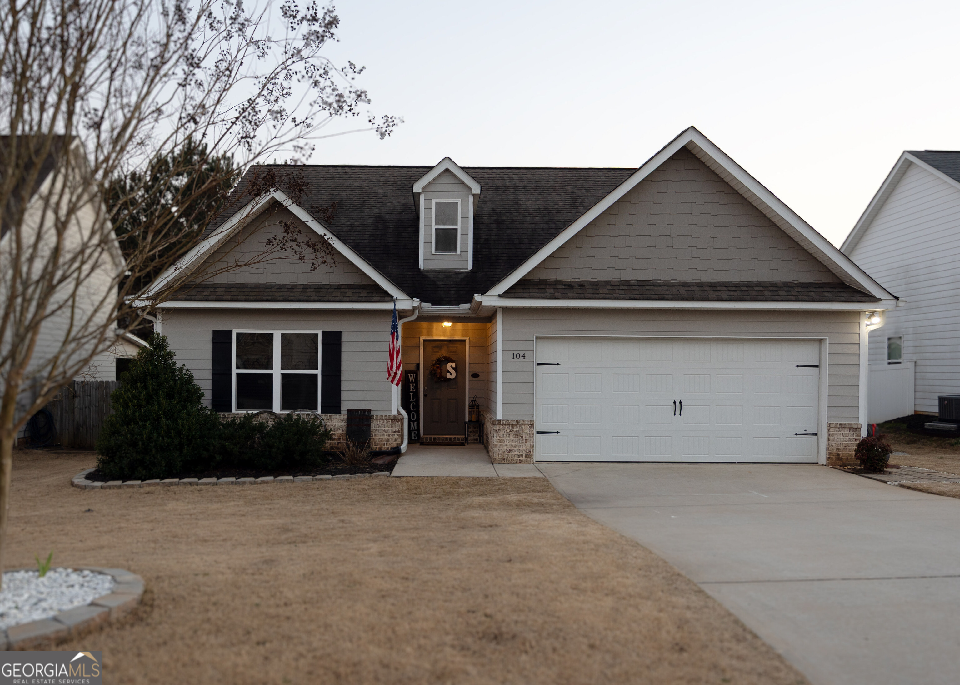 a front view of a house with a yard