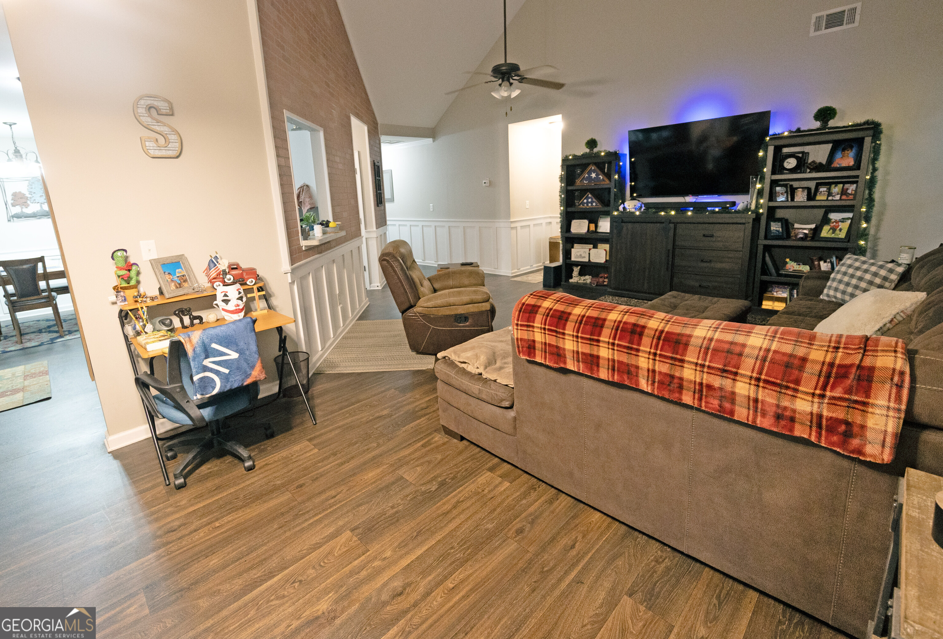 104 Savannah Way Milner, GA 30257 - Photo 15 of 27 a living room with furniture and a flat screen tv
