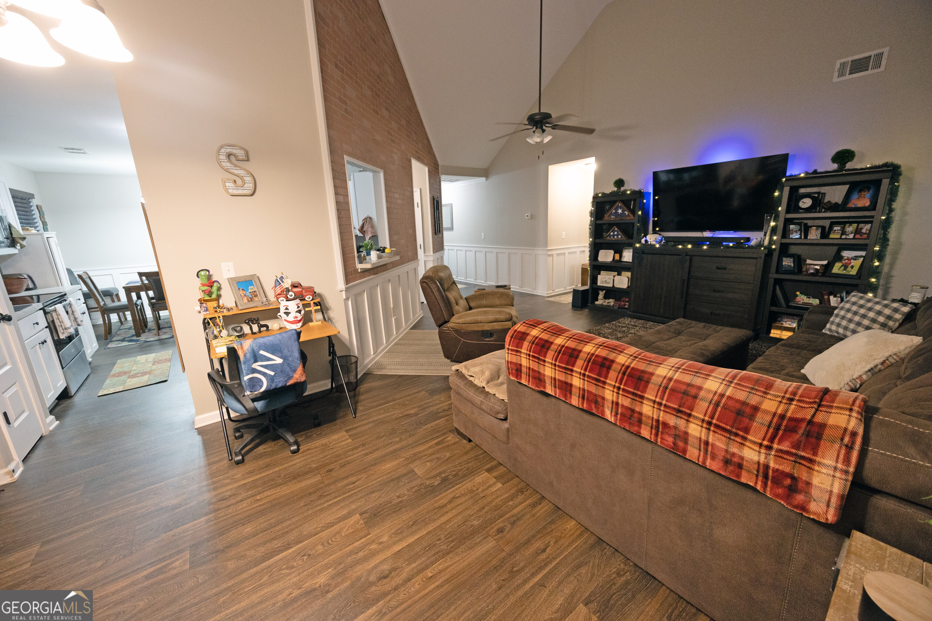 104 Savannah Way Milner, GA 30257 - Photo 16 of 27 a living room with furniture and a flat screen tv