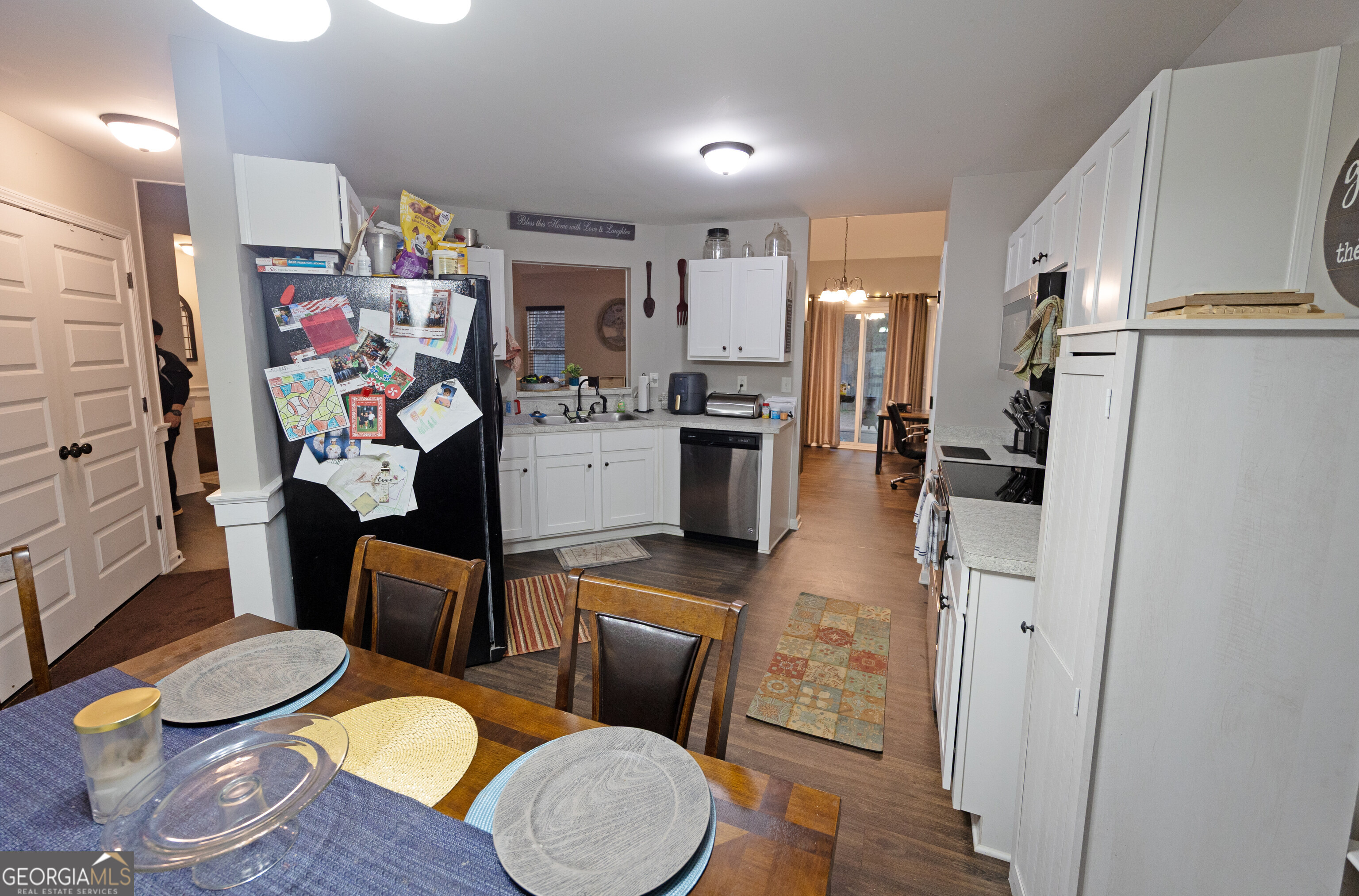 104 Savannah Way Milner, GA 30257 - Photo 19 of 27 a living room with stainless steel appliances furniture and a view of kitchen