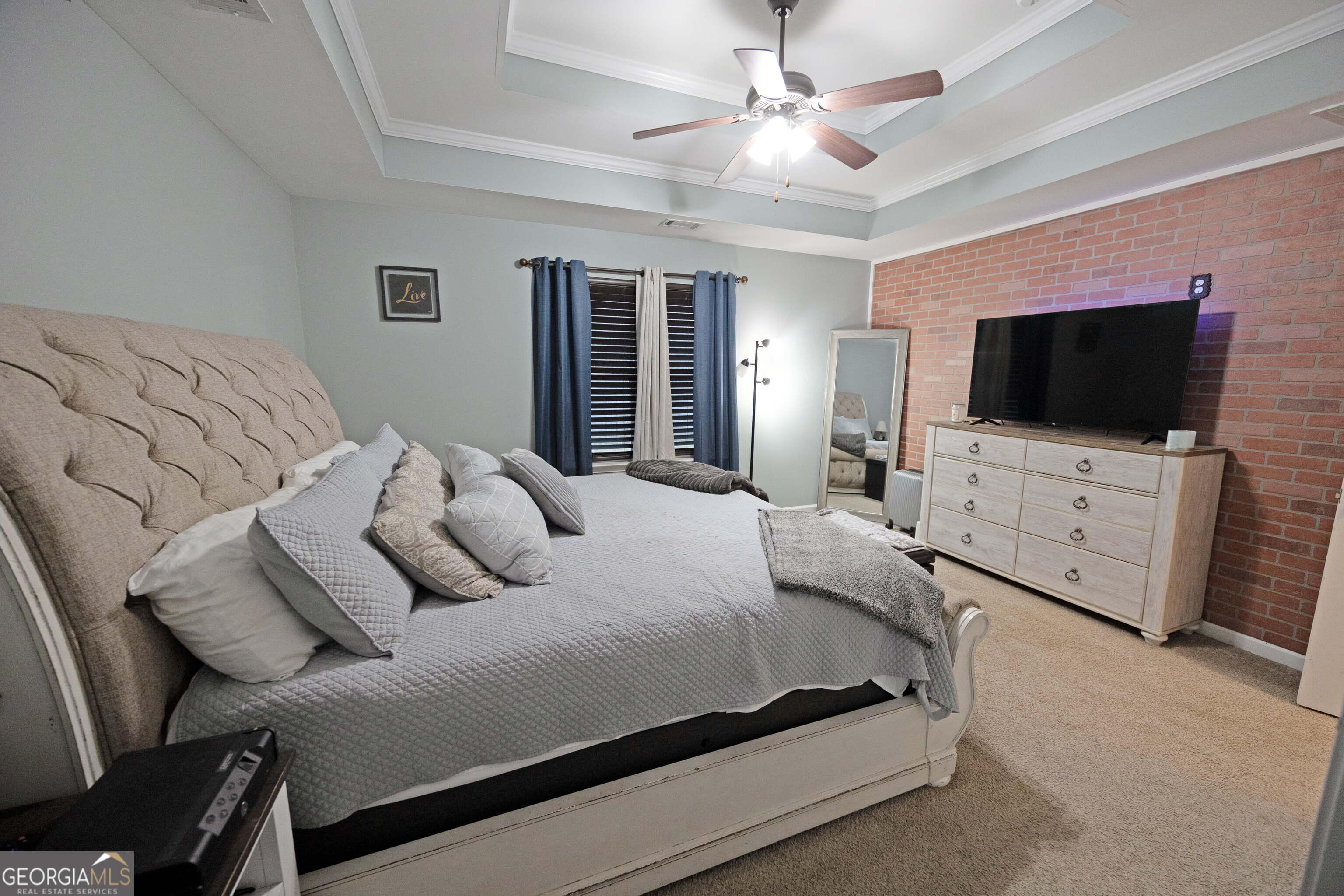 104 Savannah Way Milner, GA 30257 - Photo 22 of 27 a bedroom with furniture and a flat screen tv