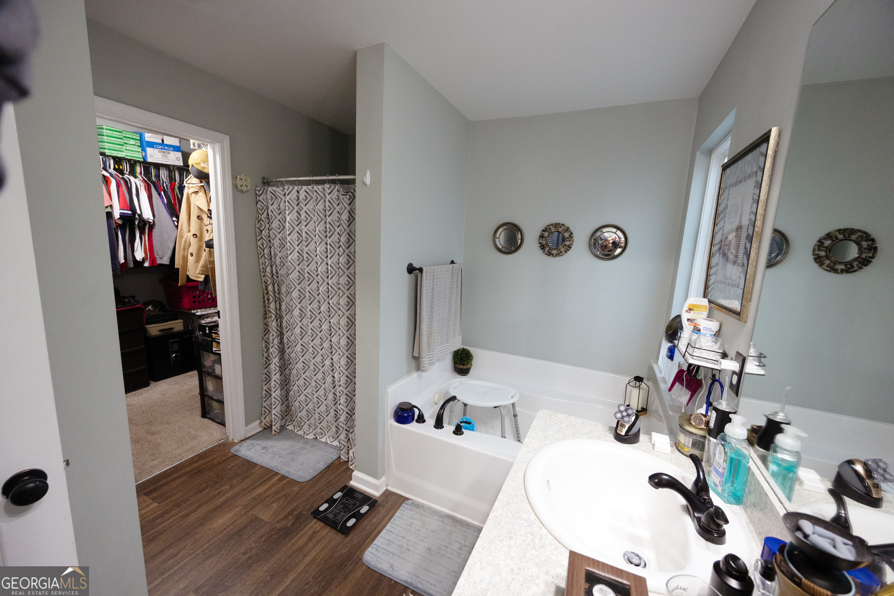 104 Savannah Way Milner, GA 30257 - Photo 24 of 27 a bathroom with a tub and a sink