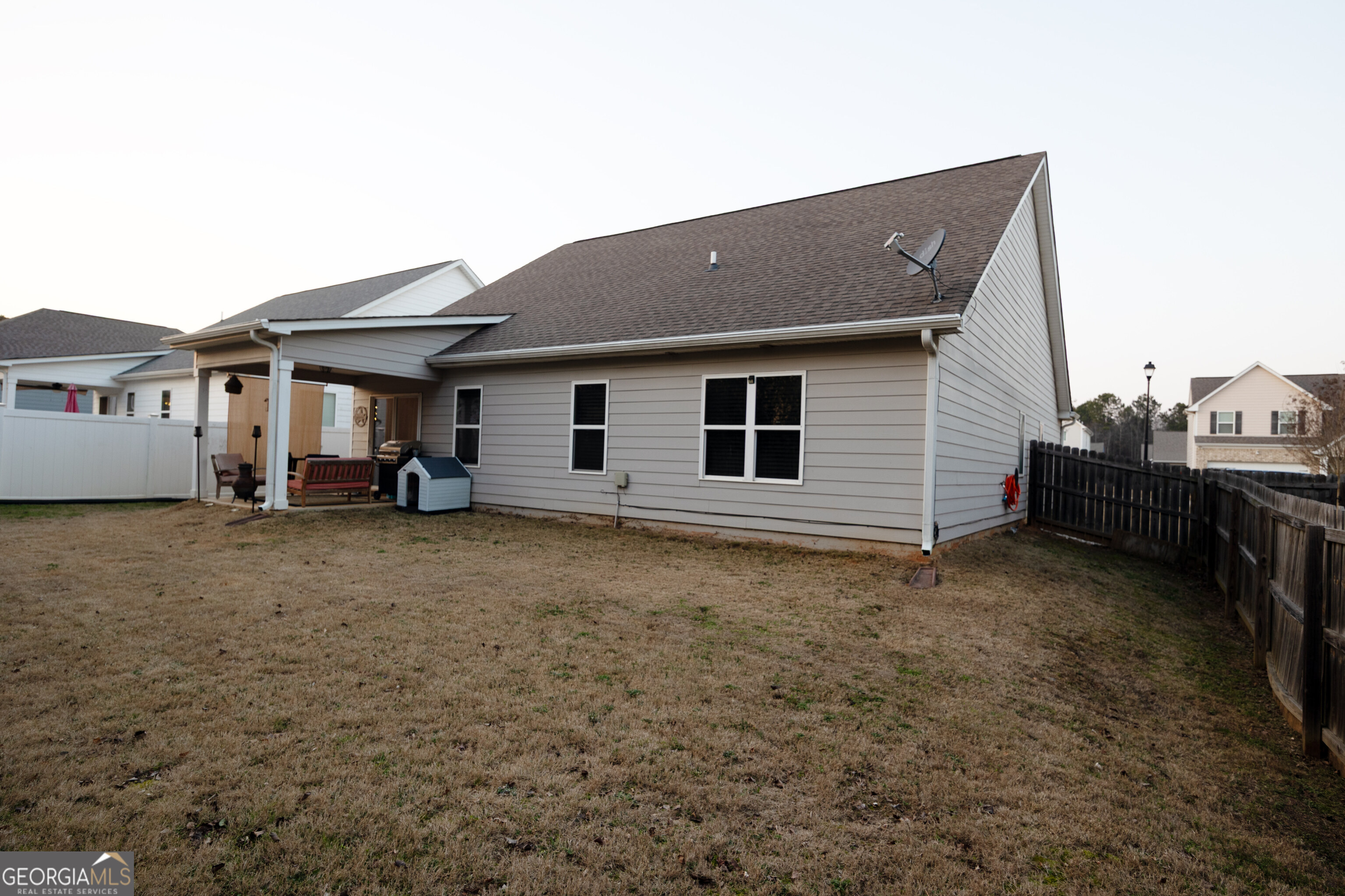 104 Savannah Way Milner, GA 30257 - Photo 27 of 27 a house view with a backyard space
