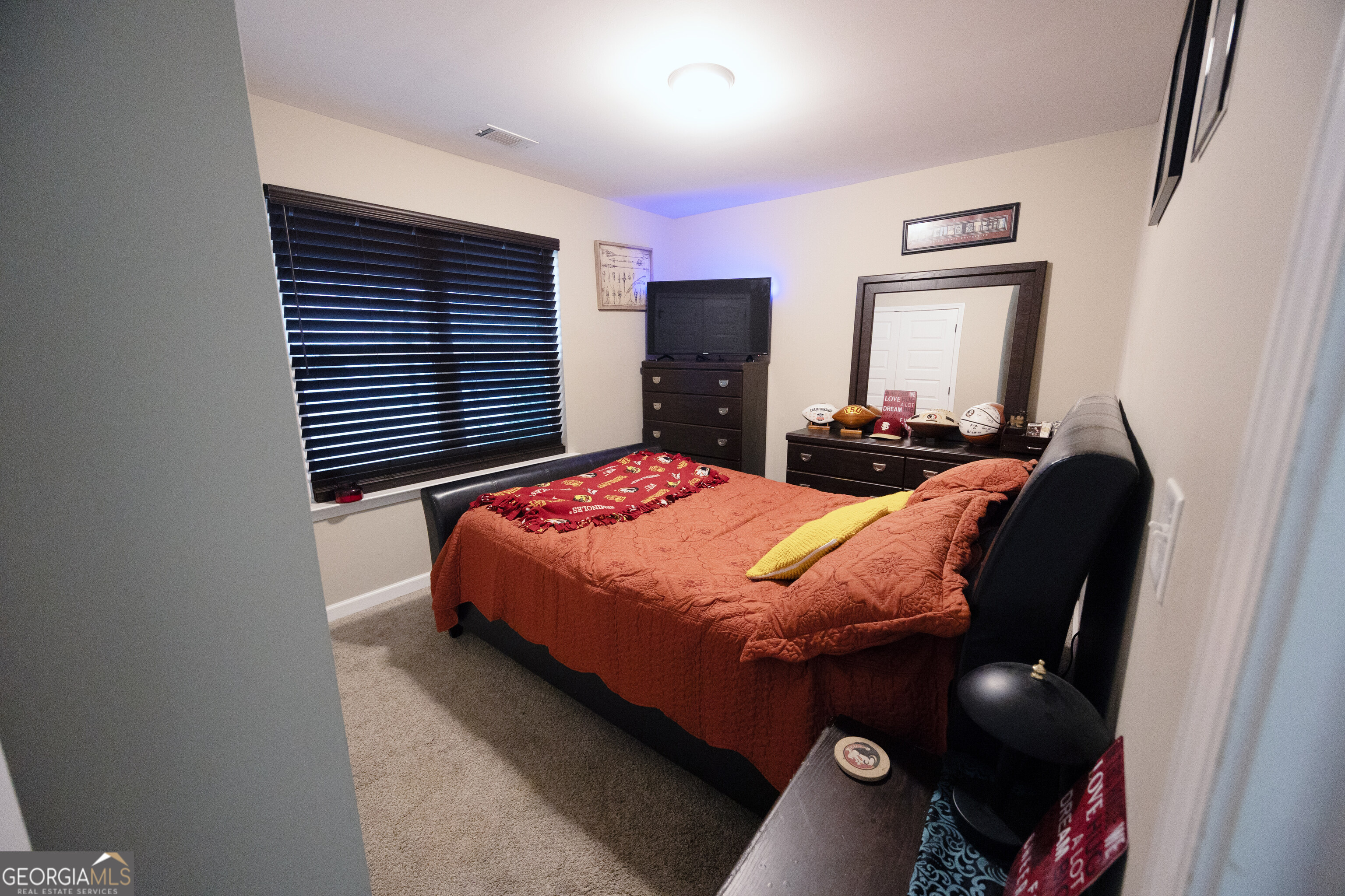 104 Savannah Way Milner, GA 30257 - Photo 6 of 27 a bedroom with a bed and furniture